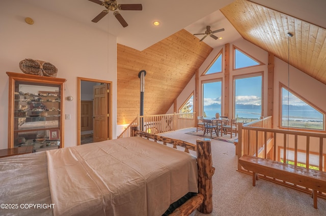 2032 Horizon Ct, Homer, AK 99603 - carpeted bedroom with a water view, multiple windows, access to outside, and high vaulted ceiling