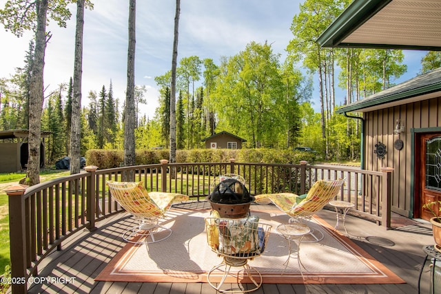 38686 Hart Ct, Soldotna, AK 99669 - wooden terrace with view of scattered trees
