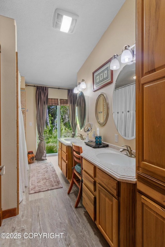 38686 Hart Ct, Soldotna, AK 99669 - bathroom with vanity and wood finished floors