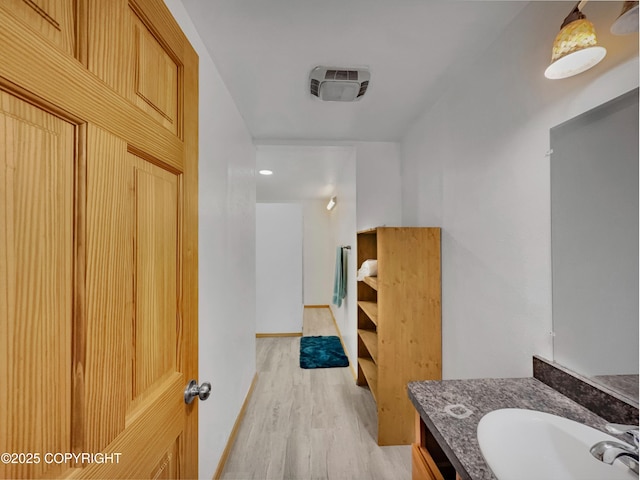 26839 S Talkeetna Spur Rd, Talkeetna, AK 99676 - bathroom featuring wood finished floors, vanity, and baseboards