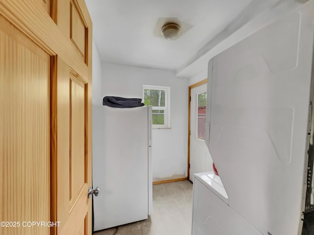 26839 S Talkeetna Spur Rd, Talkeetna, AK 99676 - washroom featuring stacked washing machine and dryer