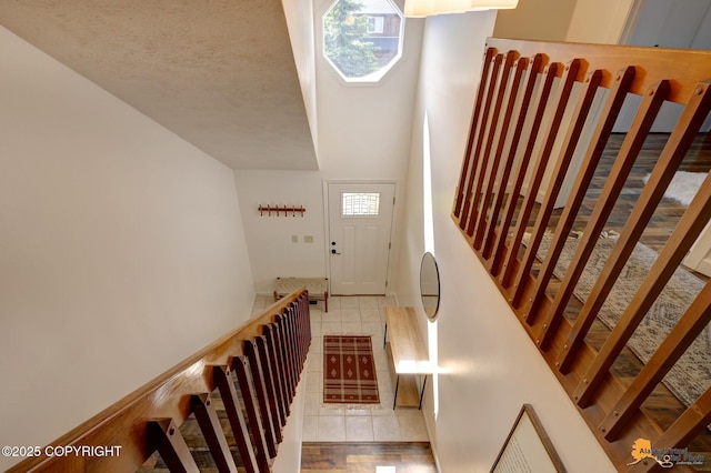 3941 Eric Cir, Anchorage, AK 99507 - stairs featuring tile patterned flooring