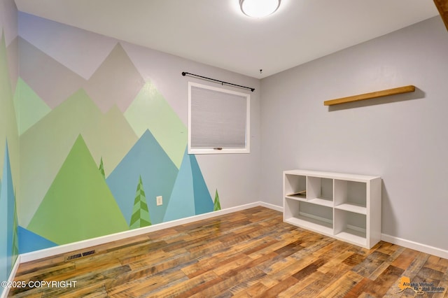 3941 Eric Cir, Anchorage, AK 99507 - unfurnished room featuring wood finished floors and baseboards