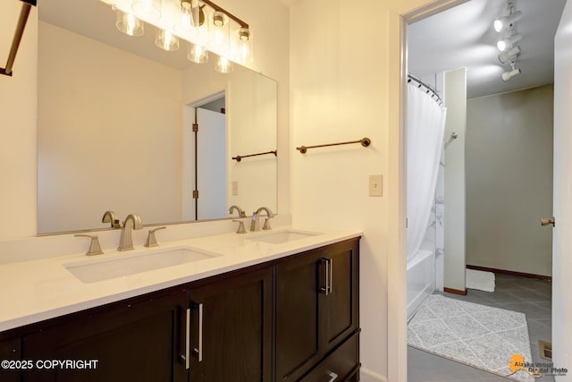 3941 Eric Cir, Anchorage, AK 99507 - full bath with double vanity, tile patterned floors, and shower / bath combo
