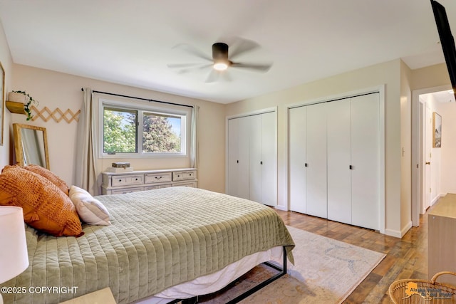 3941 Eric Cir, Anchorage, AK 99507 - bedroom with multiple closets, wood finished floors, and a ceiling fan