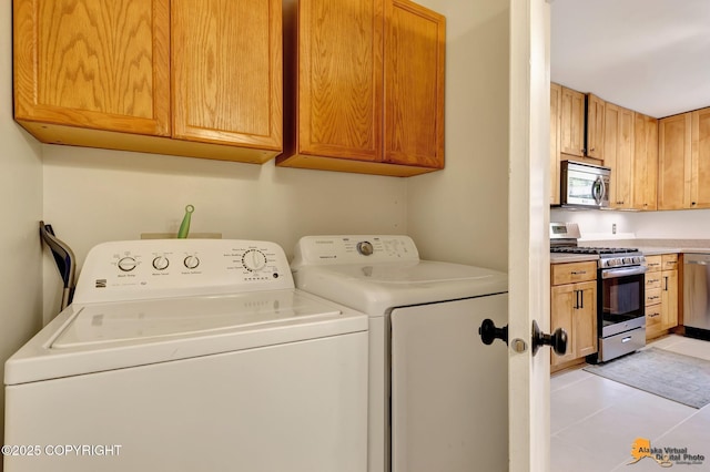 3941 Eric Cir, Anchorage, AK 99507 - washroom with washer and clothes dryer and light tile patterned floors