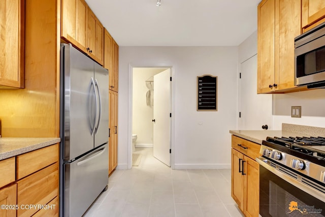 3941 Eric Cir, Anchorage, AK 99507 - kitchen featuring stainless steel appliances and light stone countertops