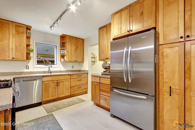 3941 Eric Cir, Anchorage, AK 99507 - kitchen featuring stainless steel appliances, open shelves, light countertops, track lighting, and light tile patterned flooring