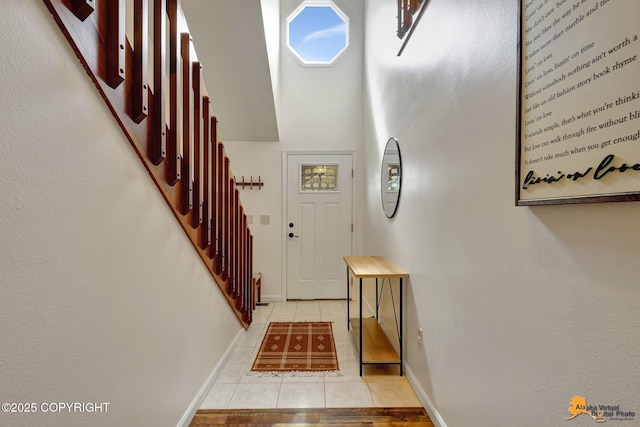 3941 Eric Cir, Anchorage, AK 99507 - entrance foyer featuring light tile patterned floors and stairway