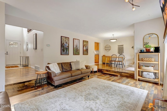3941 Eric Cir, Anchorage, AK 99507 - living area with hardwood / wood-style flooring and baseboards