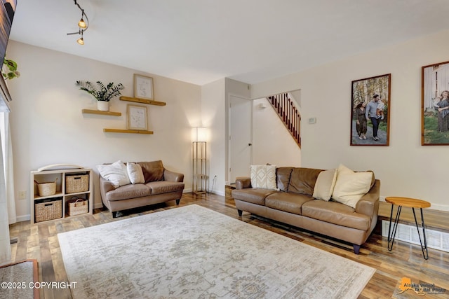 3941 Eric Cir, Anchorage, AK 99507 - living room with wood finished floors and stairway