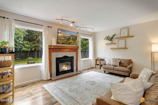 3941 Eric Cir, Anchorage, AK 99507 - living room with wood finished floors and a high end fireplace