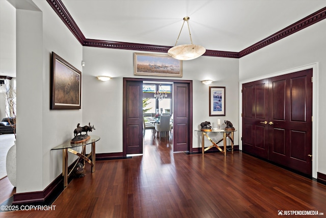 9900 Hillhaven Cir, Anchorage, AK 99507 - entryway with wood finished floors and crown molding