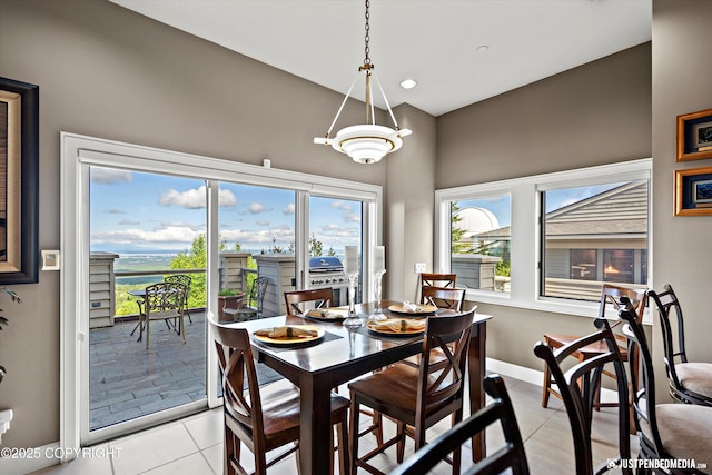 9900 Hillhaven Cir, Anchorage, AK 99507 - dining area featuring light tile patterned flooring, a towering ceiling, and recessed lighting