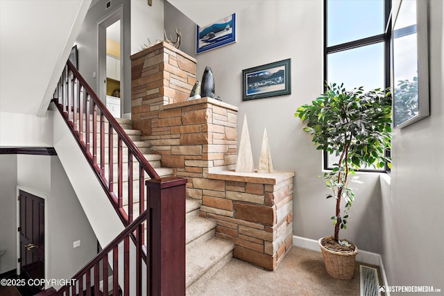 9900 Hillhaven Cir, Anchorage, AK 99507 - staircase featuring carpet and baseboards
