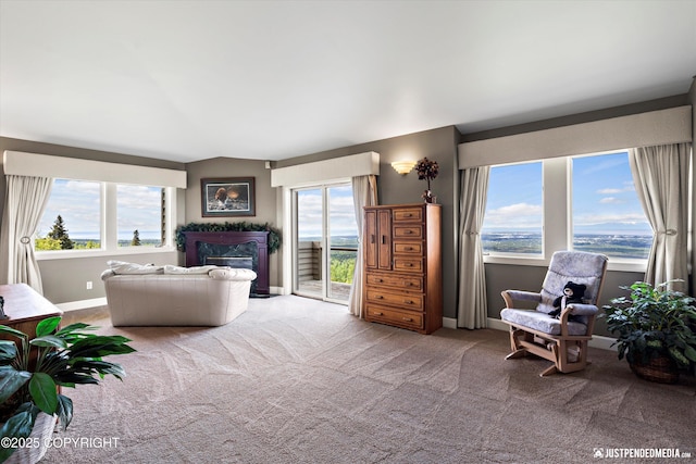 9900 Hillhaven Cir, Anchorage, AK 99507 - carpeted living room with a fireplace and healthy amount of natural light
