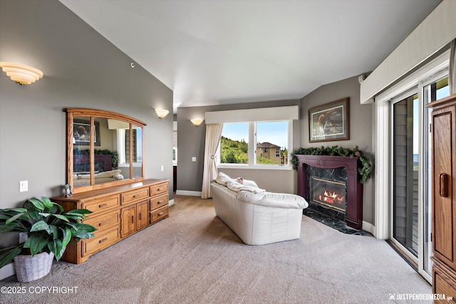 9900 Hillhaven Cir, Anchorage, AK 99507 - living area with light carpet, lofted ceiling, and a fireplace