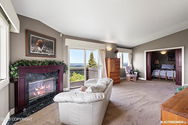 9900 Hillhaven Cir, Anchorage, AK 99507 - living area with lofted ceiling, carpet floors, and a premium fireplace