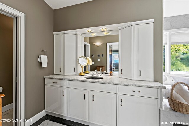 9900 Hillhaven Cir, Anchorage, AK 99507 - bathroom with vanity and baseboards