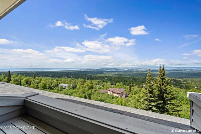 9900 Hillhaven Cir, Anchorage, AK 99507 - balcony featuring a forest view
