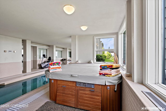 9900 Hillhaven Cir, Anchorage, AK 99507 - view of patio / terrace with an indoor hot tub