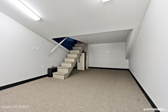 9900 Hillhaven Cir, Anchorage, AK 99507 - below grade area featuring carpet flooring and stairs