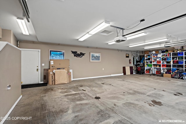 9900 Hillhaven Cir, Anchorage, AK 99507 - garage with a garage door opener and baseboards