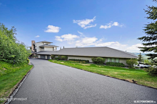 9900 Hillhaven Cir, Anchorage, AK 99507 - view of front facade with driveway, a garage, and a front lawn
