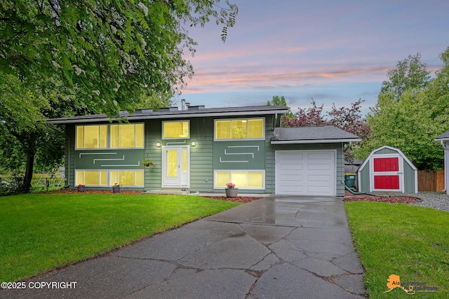3868 Shannon Cir, Anchorage, AK 99508 - view of front of home featuring an attached garage and concrete driveway