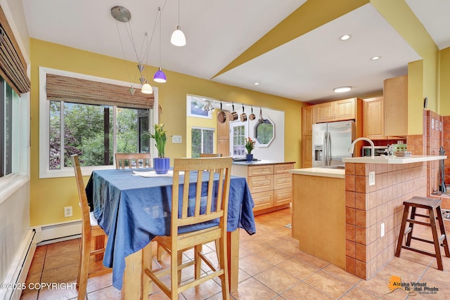 3868 Shannon Cir, Anchorage, AK 99508 - dining space with baseboard heating, light tile patterned floors, vaulted ceiling, and recessed lighting