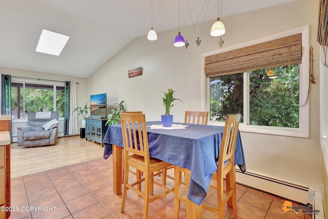 3868 Shannon Cir, Anchorage, AK 99508 - tiled dining area with a skylight, a baseboard heating unit, and vaulted ceiling