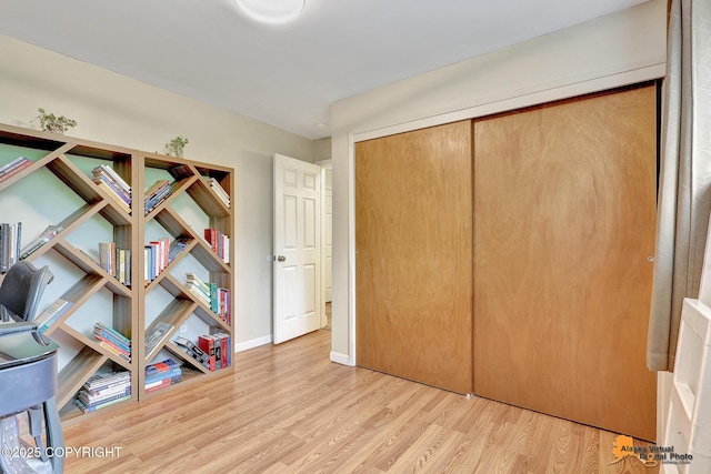 3868 Shannon Cir, Anchorage, AK 99508 - bedroom featuring wood finished floors, a closet, and baseboards