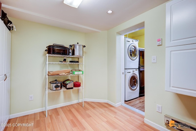 3868 Shannon Cir, Anchorage, AK 99508 - laundry room featuring estacked washer and dryer, light wood-type flooring, baseboards, and recessed lighting