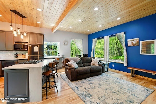 23069 Christiansen Lake Rd, Talkeetna, AK 99676 - living area with recessed lighting, light wood-style flooring, and a wooden ceiling with exposed beams