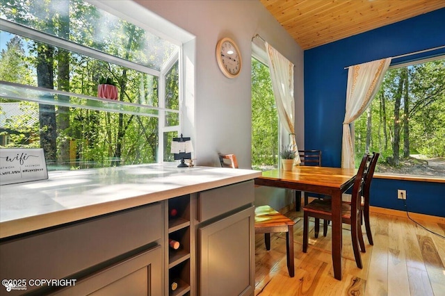 23069 Christiansen Lake Rd, Talkeetna, AK 99676 - dining room with light wood-style flooring and wooden ceiling