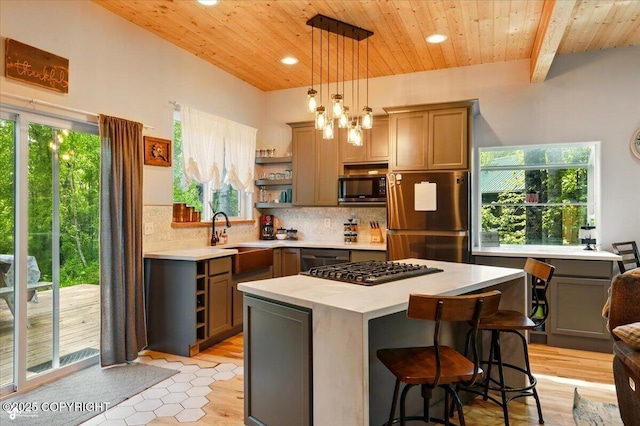 23069 Christiansen Lake Rd, Talkeetna, AK 99676 - kitchen featuring stainless steel appliances, open shelves, light countertops, wooden ceiling, and decorative backsplash