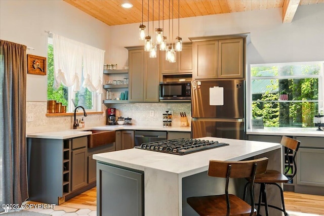 23069 Christiansen Lake Rd, Talkeetna, AK 99676 - kitchen with stainless steel appliances, open shelves, a wood ceiling with exposed beams, gray cabinetry, and backsplash