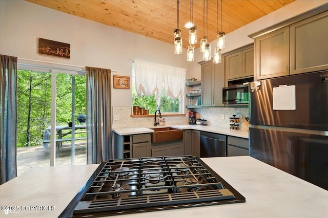 23069 Christiansen Lake Rd, Talkeetna, AK 99676 - kitchen featuring stainless steel appliances, wood ceiling, tasteful backsplash, and light countertops