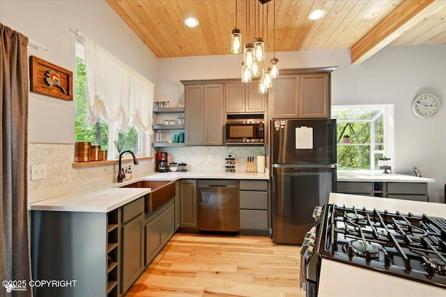 23069 Christiansen Lake Rd, Talkeetna, AK 99676 - kitchen with open shelves, stainless steel appliances, light countertops, backsplash, and recessed lighting