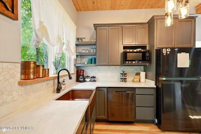 23069 Christiansen Lake Rd, Talkeetna, AK 99676 - kitchen featuring freestanding refrigerator, stainless steel microwave, decorative backsplash, open shelves, and wooden ceiling