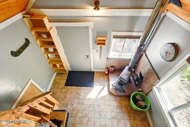 23069 Christiansen Lake Rd, Talkeetna, AK 99676 - entryway with healthy amount of natural light and a wood stove