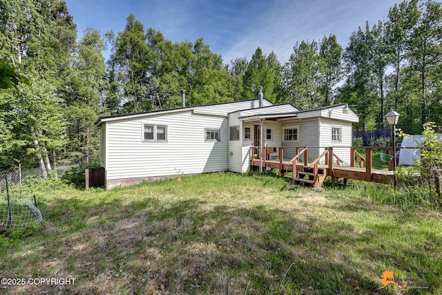 3151 E 151st Ave, Anchorage, AK 99516 - rear view of property with a deck and view of wooded area