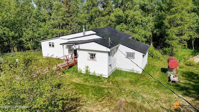 3151 E 151st Ave, Anchorage, AK 99516 - view of home's exterior with a yard and a view of trees