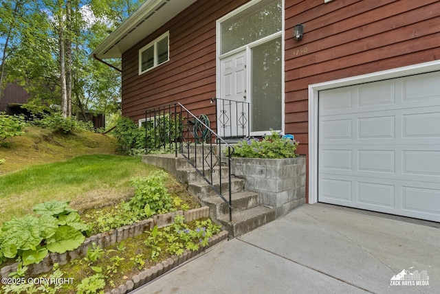 3750 Winterset Dr, Anchorage, AK 99508 - view of exterior entry with a garage