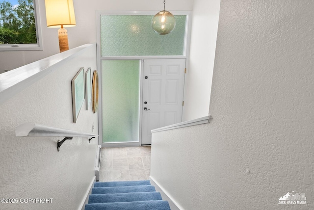 3750 Winterset Dr, Anchorage, AK 99508 - stairway with a textured wall