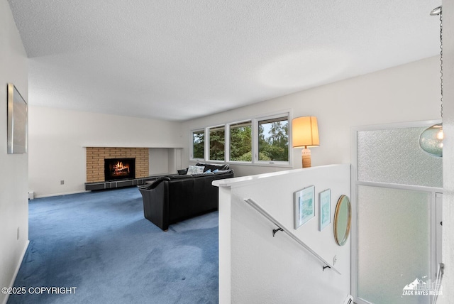 3750 Winterset Dr, Anchorage, AK 99508 - living area with carpet, a textured ceiling, and a fireplace