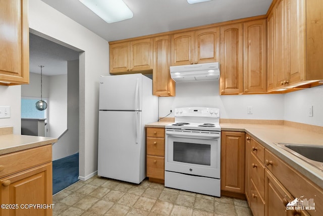 3750 Winterset Dr, Anchorage, AK 99508 - kitchen with white appliances, under cabinet range hood, and light countertops