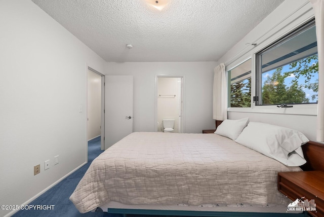 3750 Winterset Dr, Anchorage, AK 99508 - carpeted bedroom with a textured ceiling and connected bathroom