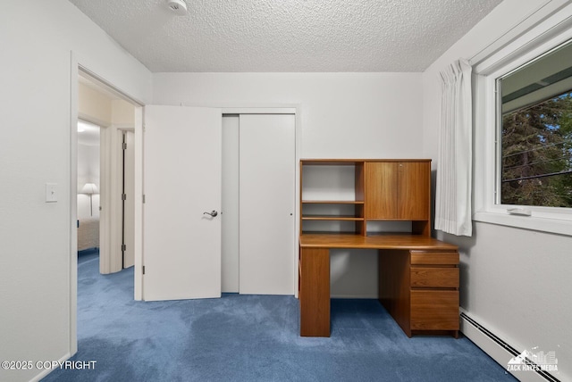 3750 Winterset Dr, Anchorage, AK 99508 - unfurnished office featuring a baseboard radiator, carpet, and a textured ceiling