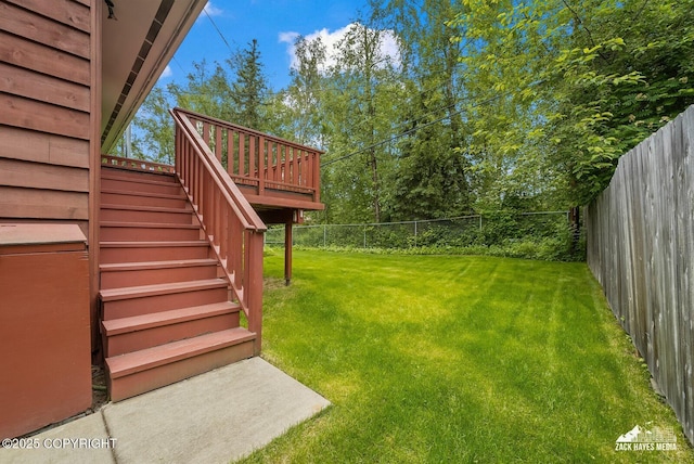 3750 Winterset Dr, Anchorage, AK 99508 - fenced backyard with stairway and a wooden deck